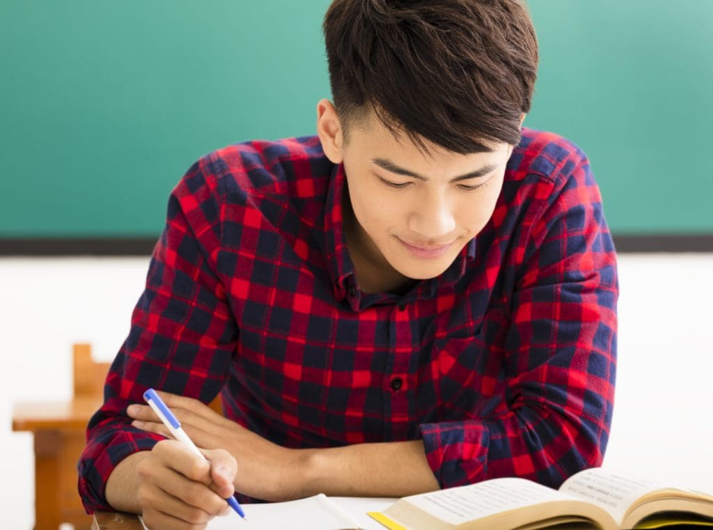 male college student study in university classroom