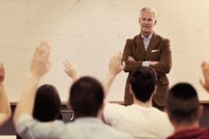 Teacher helping students learn